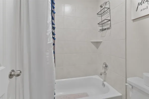 a close up of a bathtub curtain