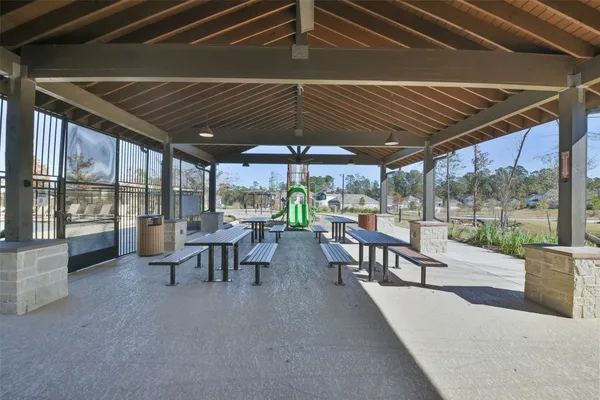 a view of a patio with chairs and table in patio