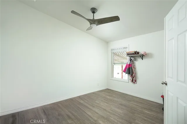 a view of a hallway with a hardwood floor