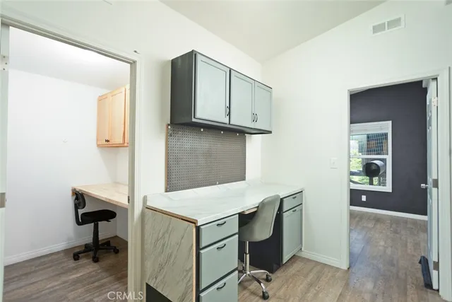 a living room with a bed furniture and a window