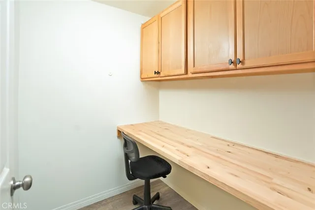 a view of a room with balcony and wooden fence
