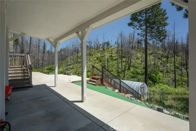 a view of a park with iron fence