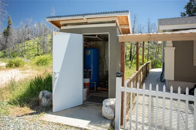 a view of a backyard with table and chairs