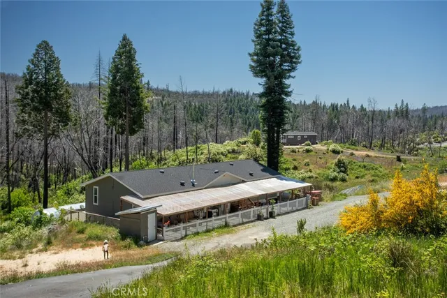 a backyard of a house with lots of green space