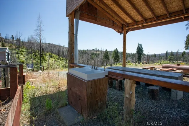 a view of a swimming pool with an outdoor seating and a garden