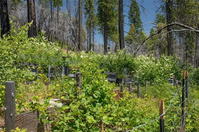 a front view of a house with garden space and sitting area