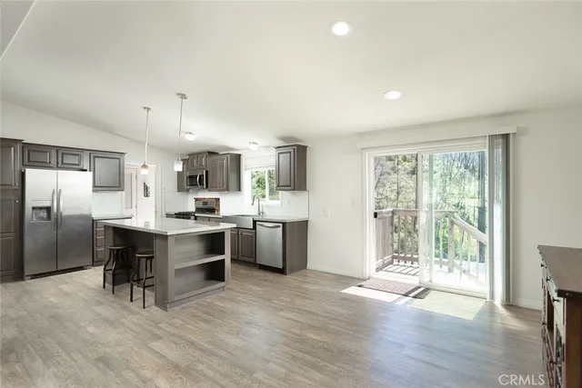 a kitchen with a sink cabinets and stainless steel appliances