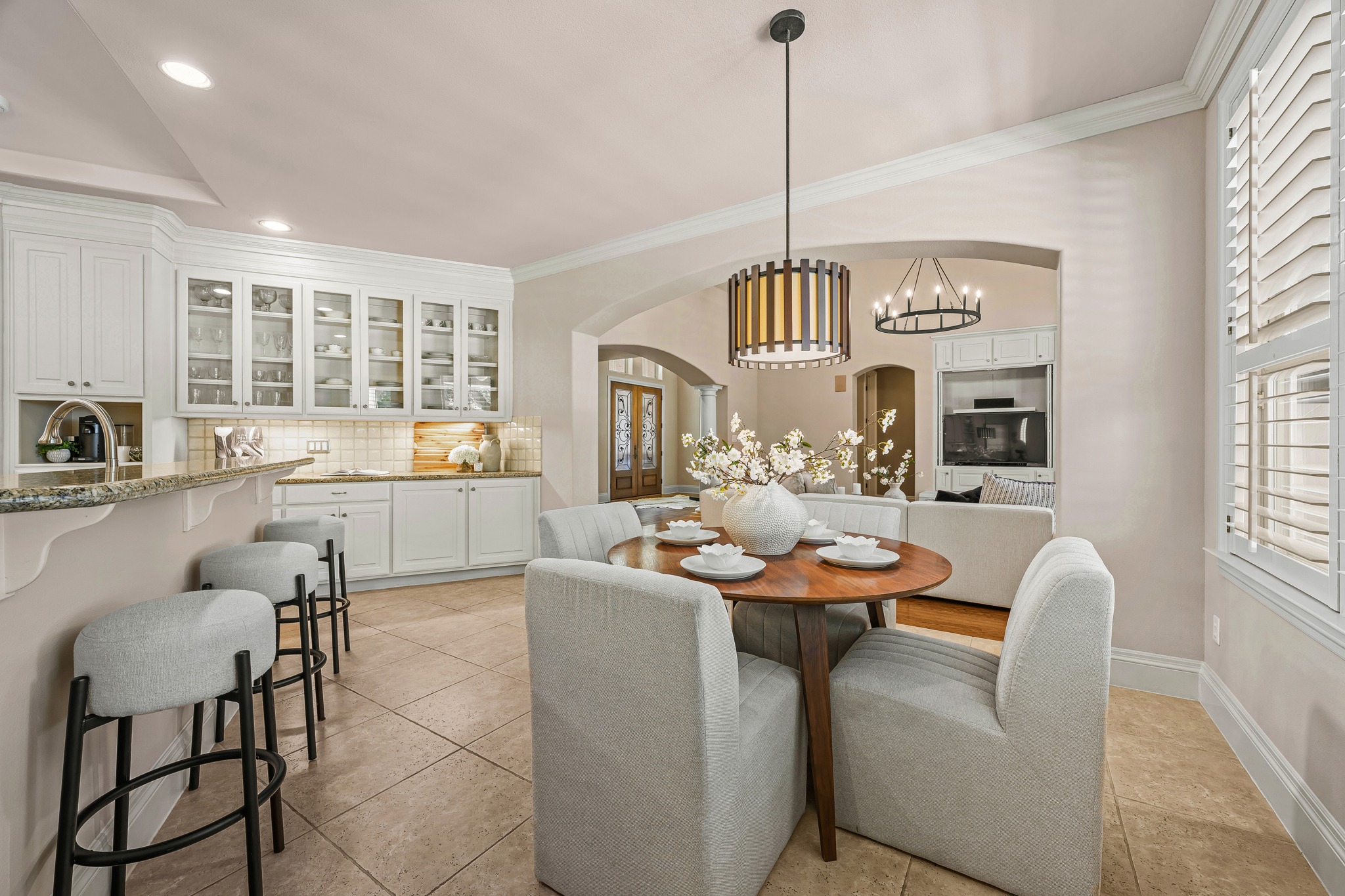 5200 Rico Cove Austin, TX 78731 - Photo 10 of 40 Arched transitions connect this tiled dining area to the surrounding living spaces.
