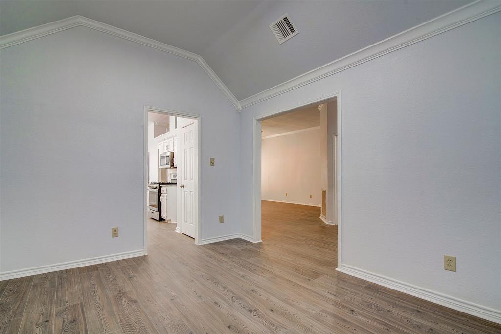 815 Fairlawn Street Allen, TX 75002 - Photo 12 of 22 an empty room with wooden floor and closet