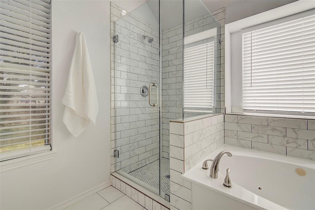 815 Fairlawn Street Allen, TX 75002 - Photo 16 of 22 a bathroom with a bathtub and shower