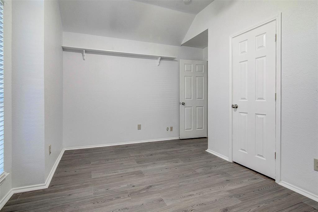 815 Fairlawn Street Allen, TX 75002 - Photo 19 of 22 a view of an empty room with wooden floor