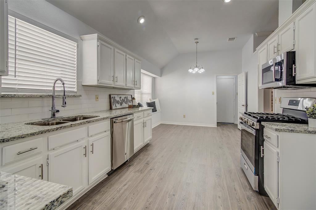 815 Fairlawn Street Allen, TX 75002 - Photo 5 of 22 a kitchen with stainless steel appliances granite countertop a sink stove and refrigerator