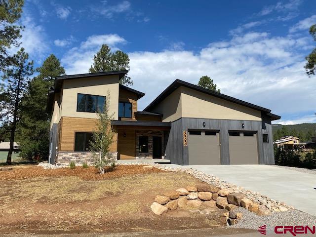 333 Edgemont Meadows Road Durango, CO 81301 - Photo 2 of 6 a front view of a house with a yard