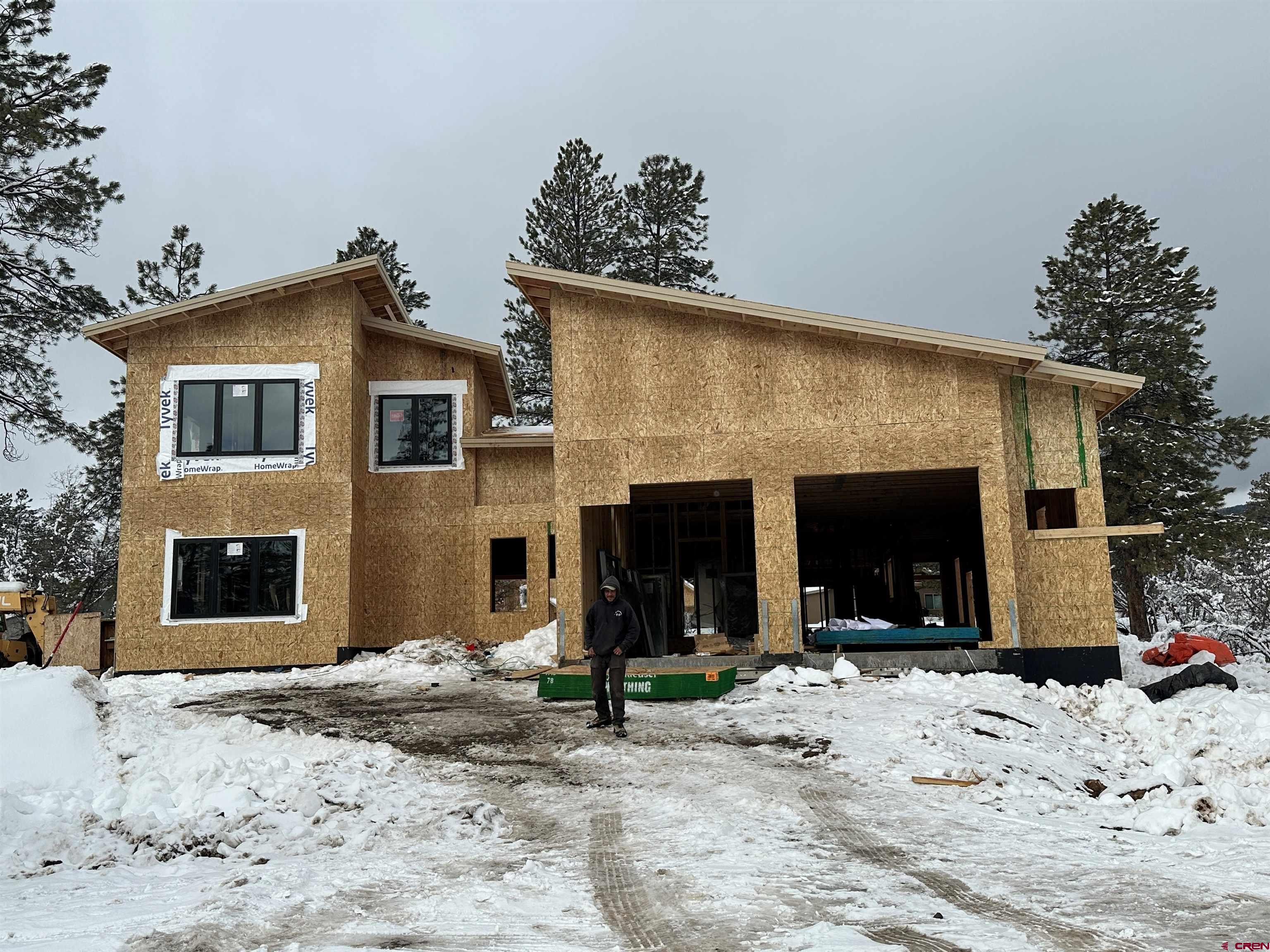 333 Edgemont Meadows Road Durango, CO 81301 - Photo 5 of 6 a view of a house with a yard and garage