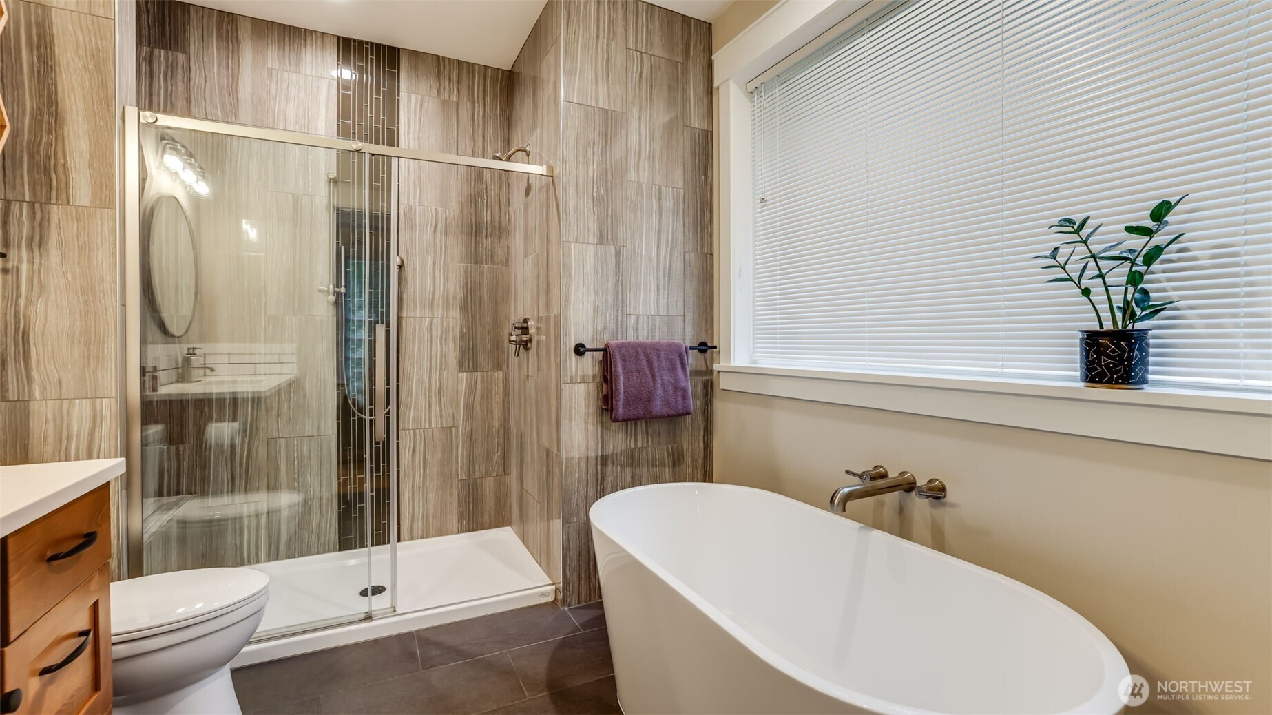 18620 Southeast 216th Street Renton, WA 98058 - Photo 18 of 28 a bathroom with a bathtub and shower