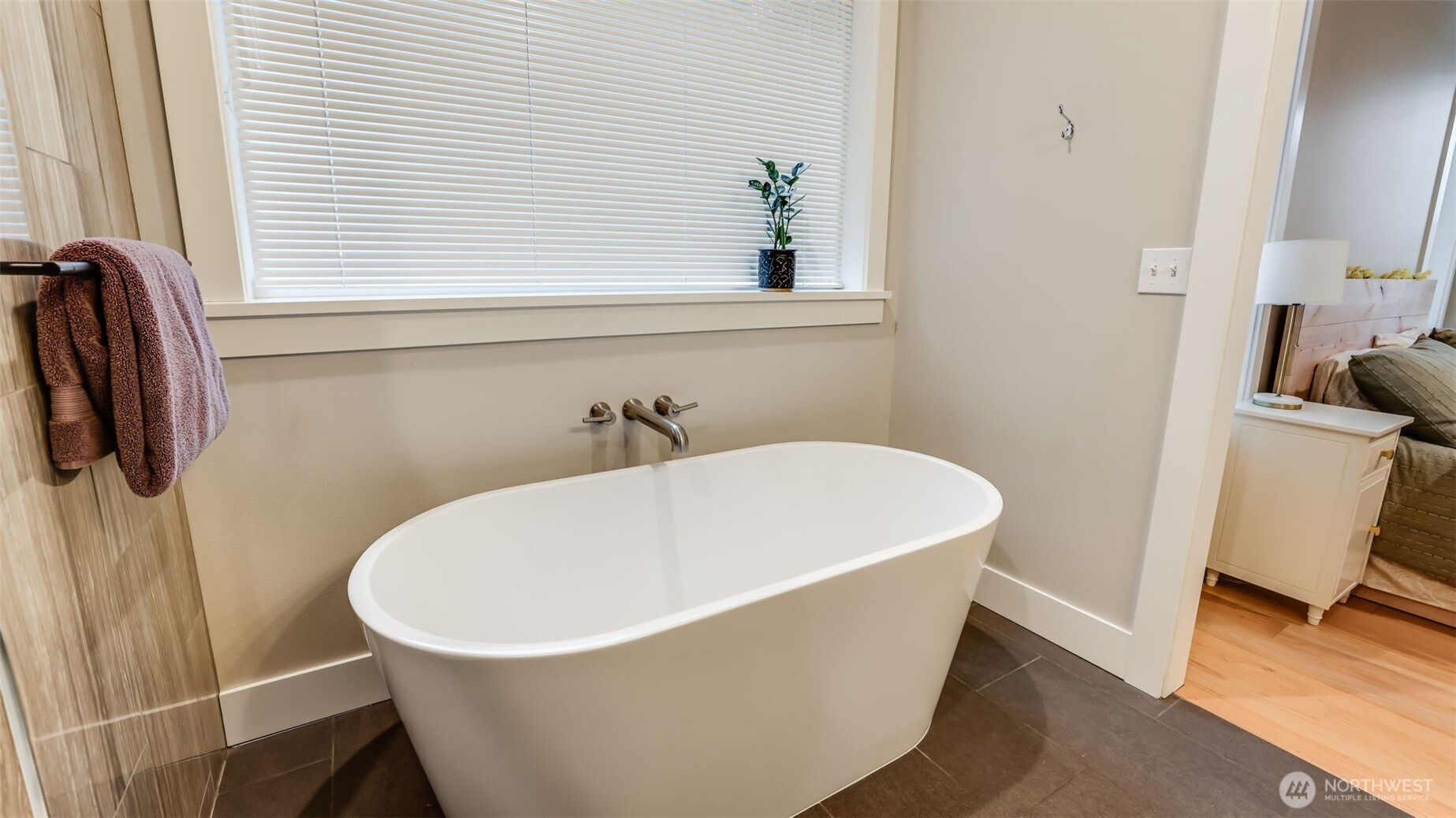 18620 Southeast 216th Street Renton, WA 98058 - Photo 19 of 28 a white bath tub sitting in a bathroom
