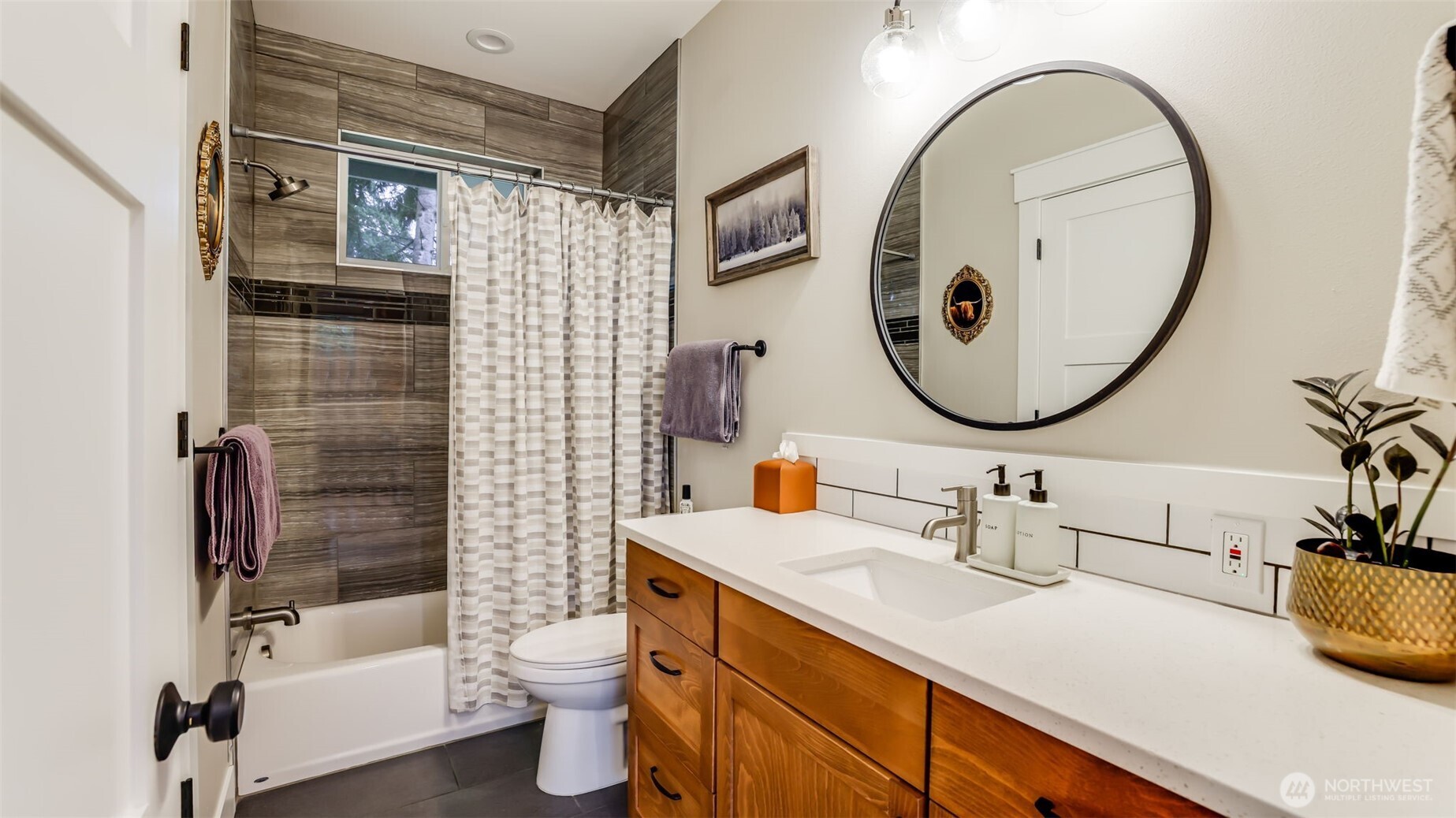 18620 Southeast 216th Street Renton, WA 98058 - Photo 23 of 28 a bathroom with a sink a toilet and a mirror