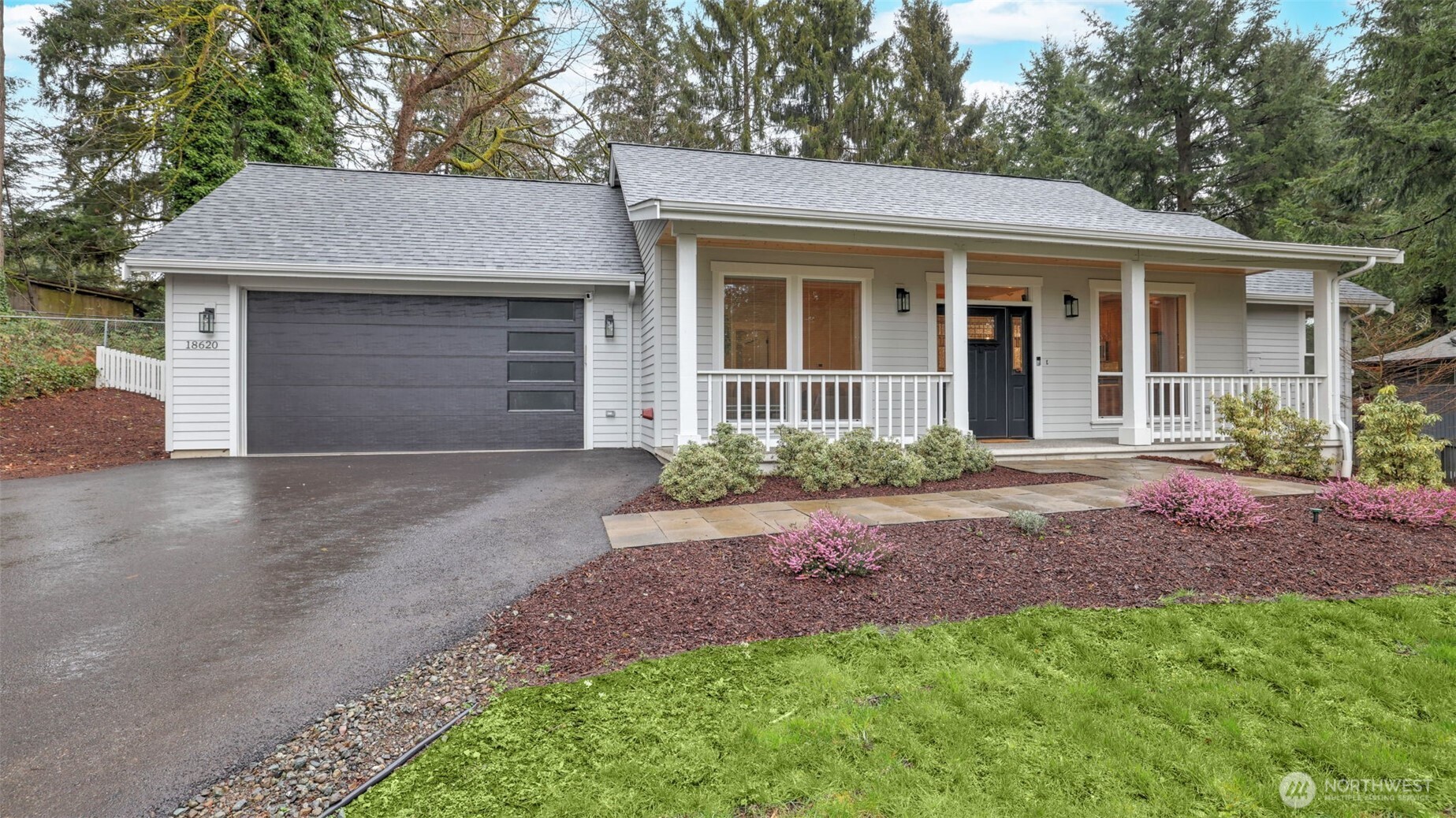 18620 Southeast 216th Street Renton, WA 98058 - Photo 27 of 28 a front view of a house with a garden and porch