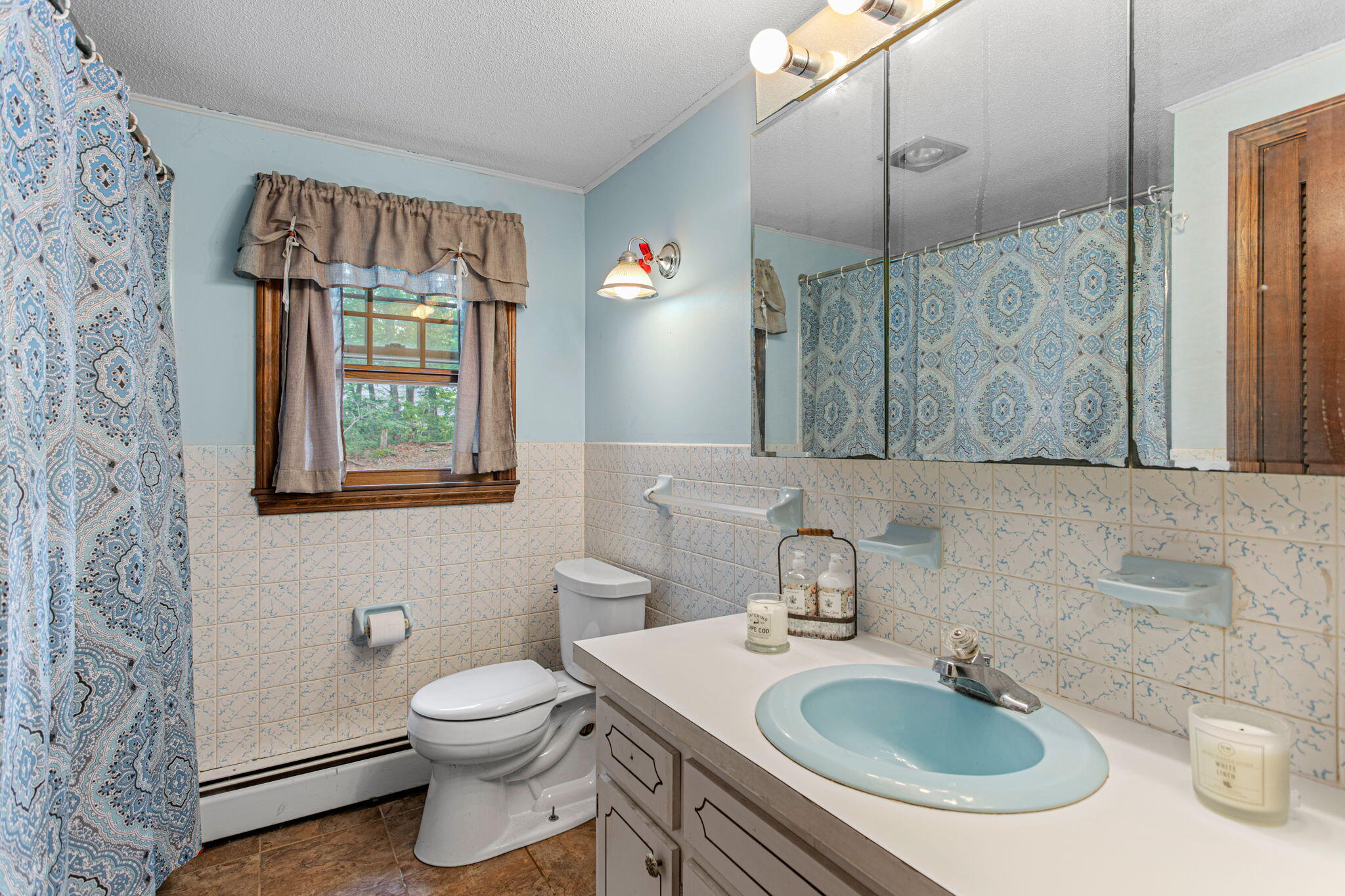 23 Meredith Road Forestdale, MA 02644 - Photo 14 of 22 a bathroom with a sink toilet and shower