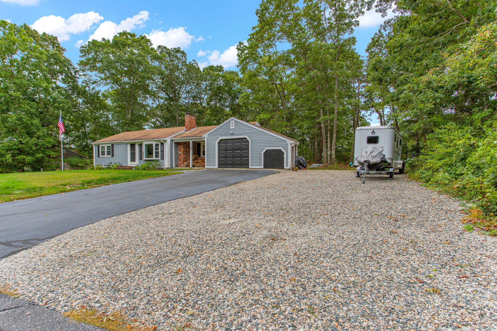 23 Meredith Road Forestdale, MA 02644 - Photo 18 of 22 a front view of a house with a yard and trees