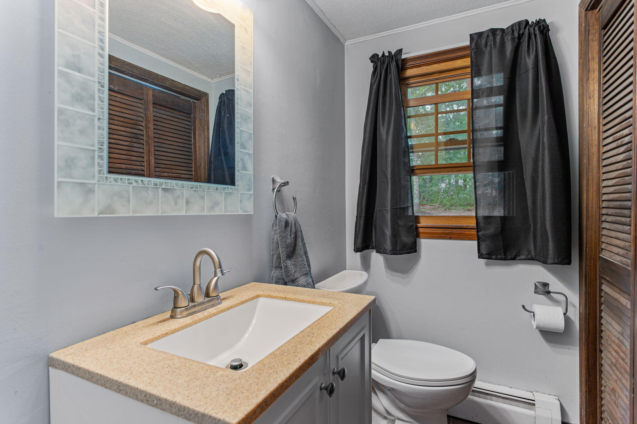 23 Meredith Road Forestdale, MA 02644 - Photo 4 of 22 a bathroom with a sink toilet and mirror
