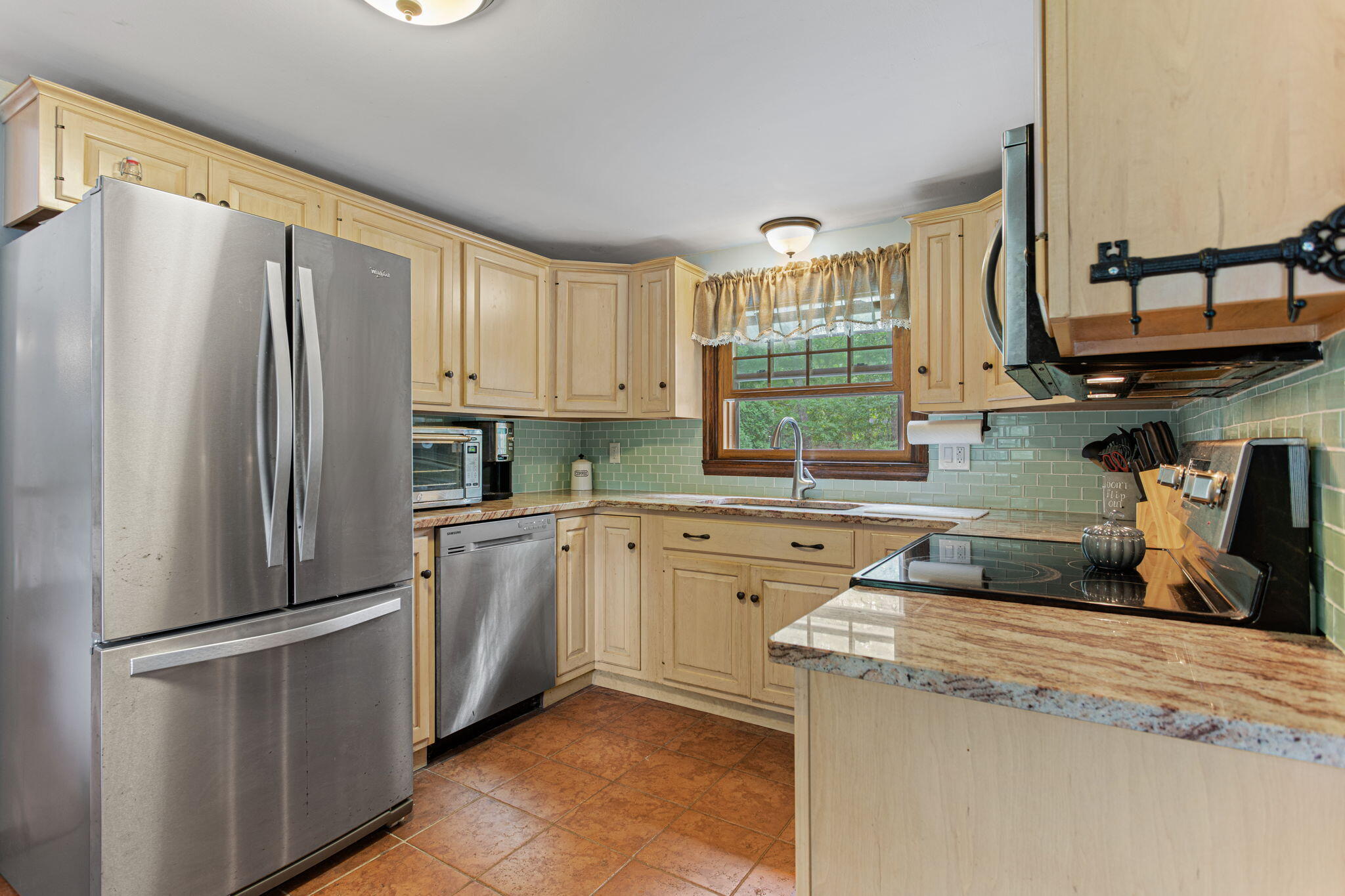 23 Meredith Road Forestdale, MA 02644 - Photo 7 of 22 a kitchen with stainless steel appliances granite countertop a refrigerator sink and cabinets
