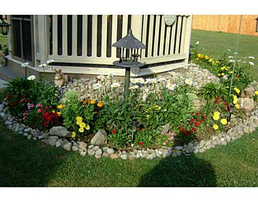 2868 Valley View Road Sharpsville, PA 16150 - Photo 16 of 18 Exterior Back. LANDSCAPING ALONG GAZEBO