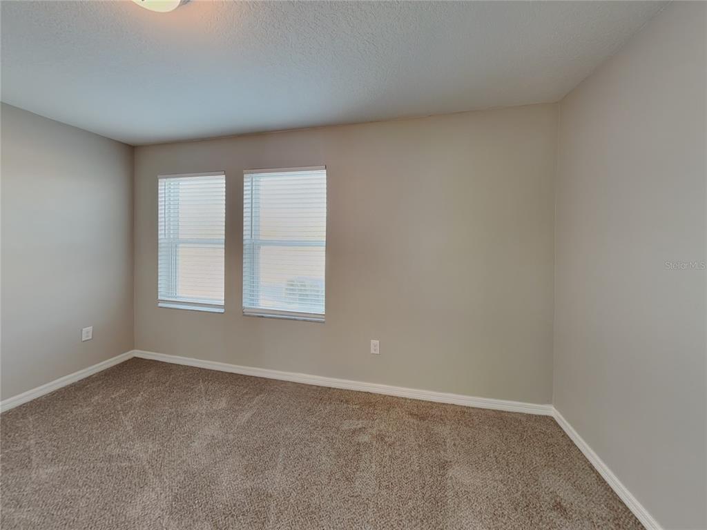 Undisclosed Address Spring Hill, FL 34609 - Photo 12 of 15 an empty room with a window
