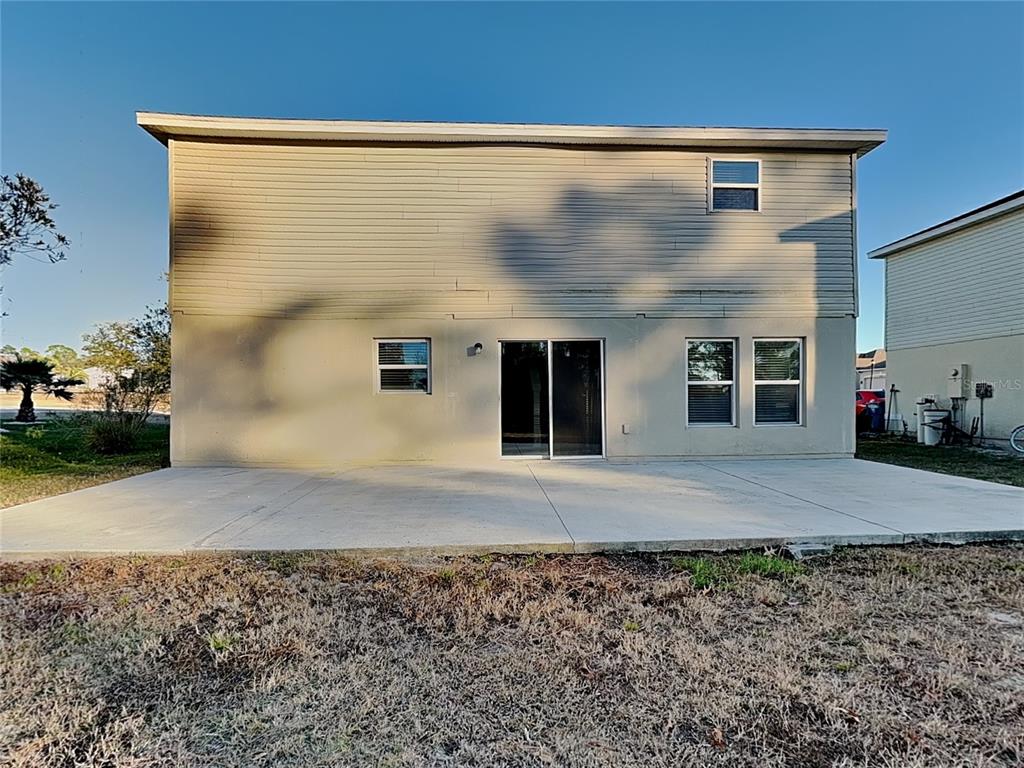 Undisclosed Address Spring Hill, FL 34609 - Photo 15 of 15 a front view of a house with a yard