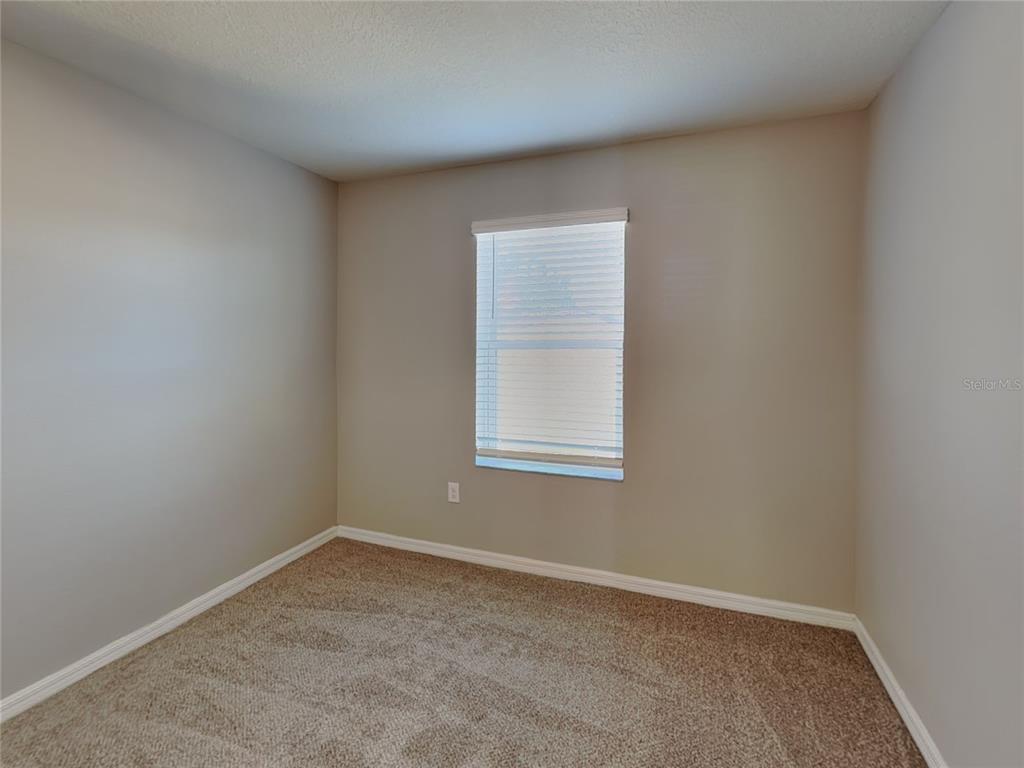 Undisclosed Address Spring Hill, FL 34609 - Photo 9 of 15 an empty room with a window