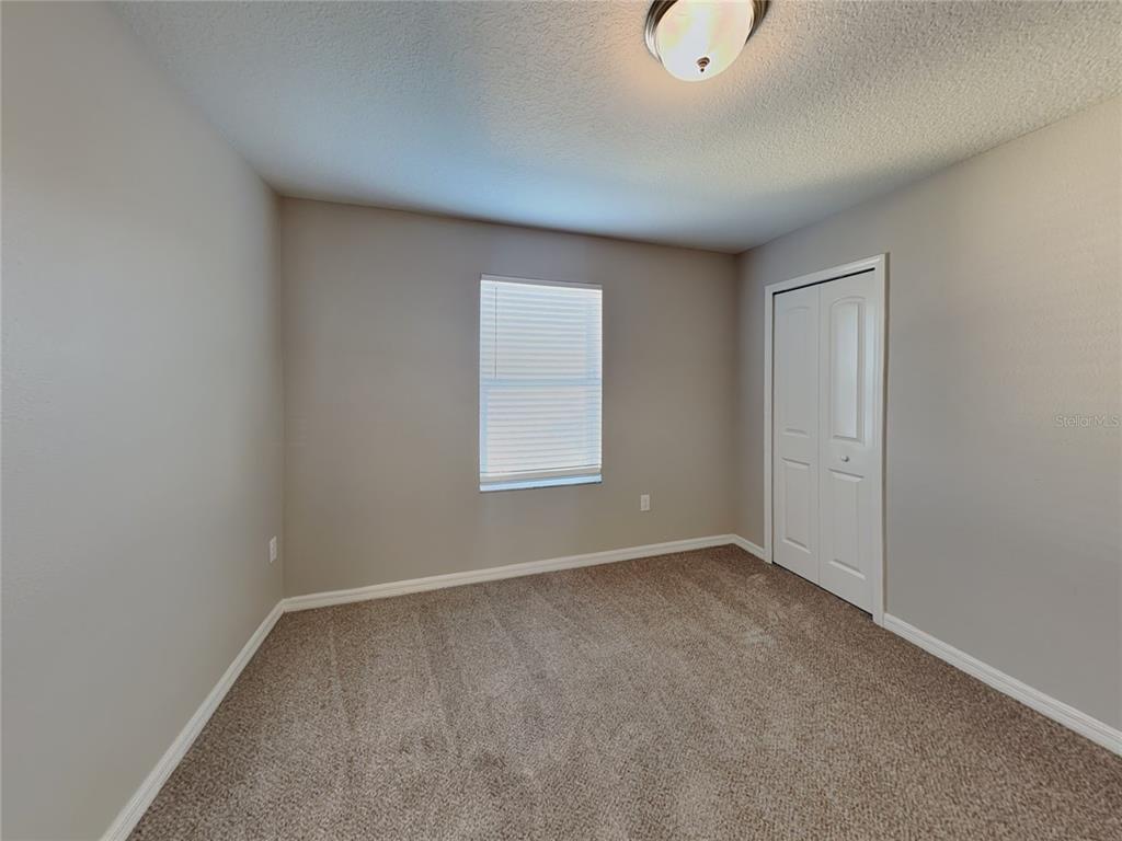 Undisclosed Address Spring Hill, FL 34609 - Photo 10 of 15 an empty room with windows