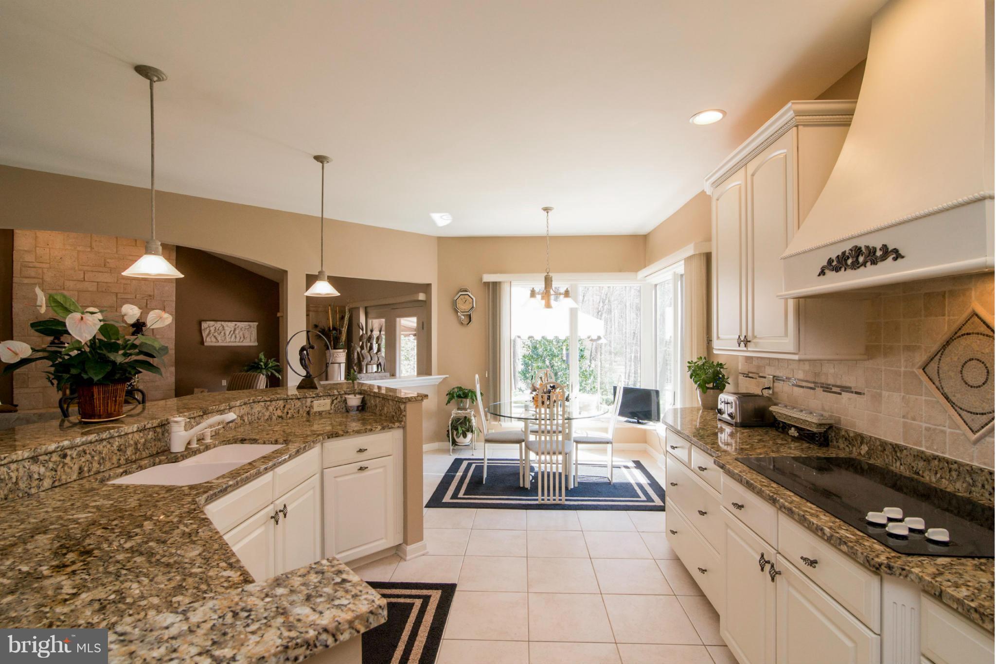 16511 York Road Monkton, MD 21111 - Photo 17 of 30 a large kitchen with stainless steel appliances kitchen island granite countertop a sink and cabinets