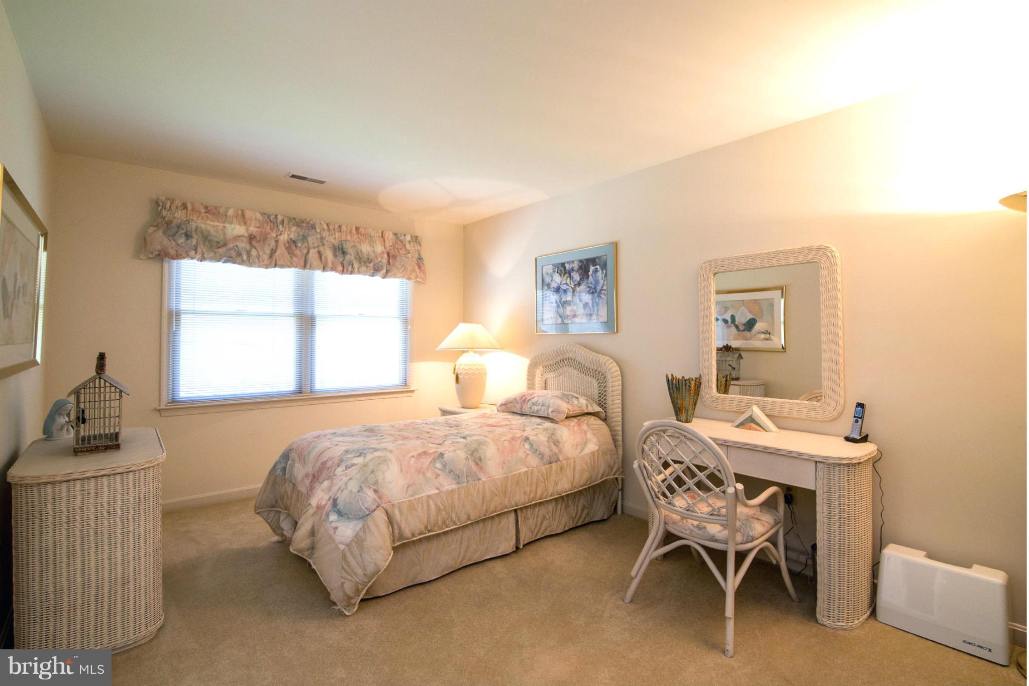 16511 York Road Monkton, MD 21111 - Photo 25 of 30 a bedroom with a bed and a table