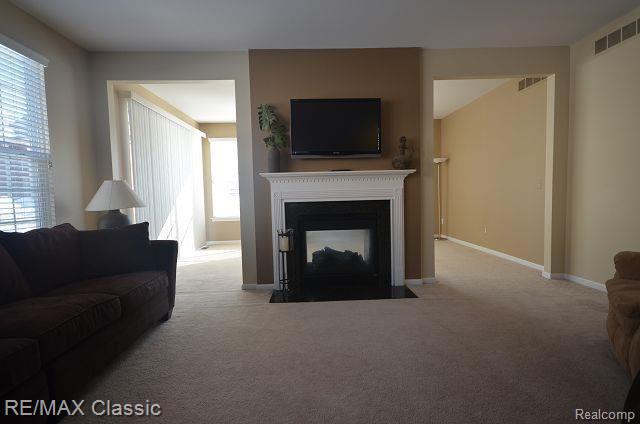 27458 Cromwell Road Novi, MI 48374 - Photo 11 of 39 Large great room with 2 way gas fireplace.
