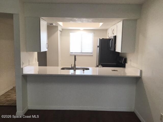 1720 Murrell Road, Unit 207 Rockledge, FL 32955 - Photo 5 of 17 Pass thru bar stool area