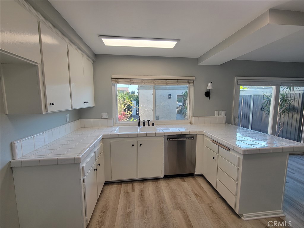 14325 Blackpool Road Westminster, CA 92683 - Photo 11 of 28 a spacious bathroom with a granite countertop sink and a mirror