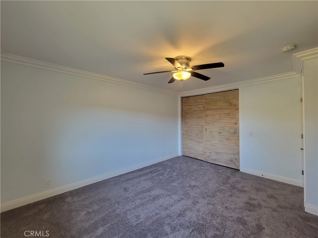 14325 Blackpool Road Westminster, CA 92683 - Photo 14 of 28 a view of an empty room with a chandelier fan