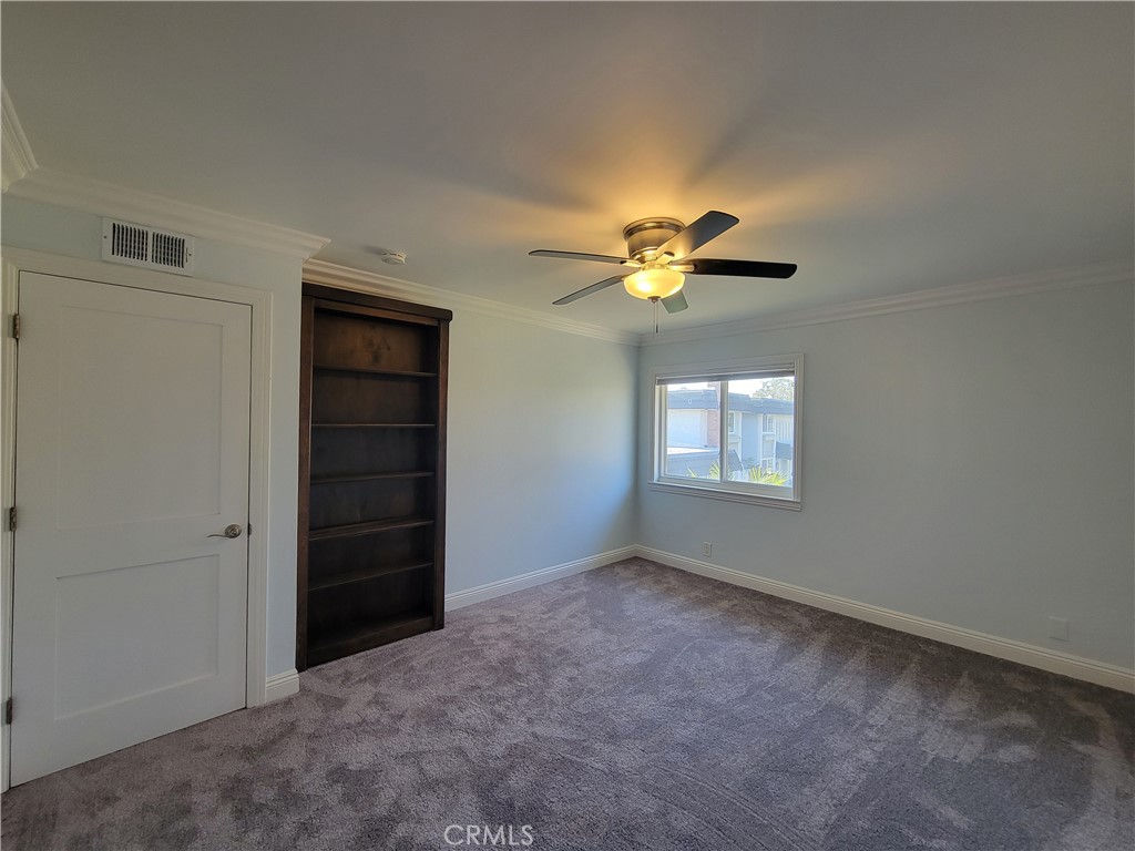 14325 Blackpool Road Westminster, CA 92683 - Photo 16 of 28 an empty room with closet and chandelier fan