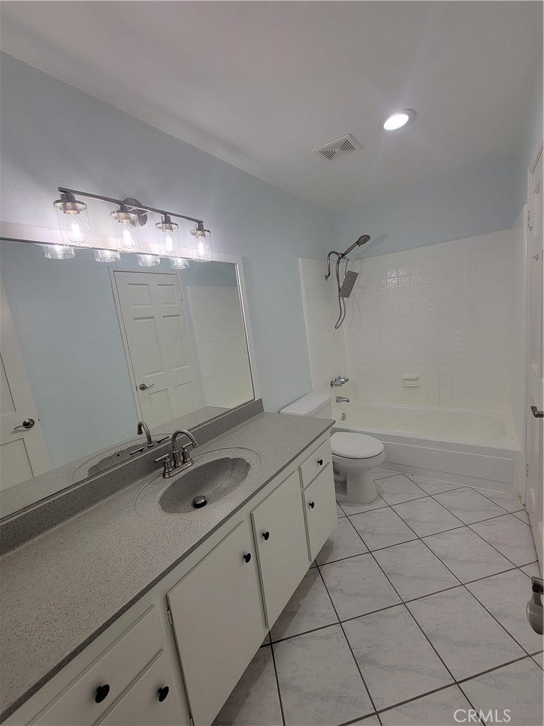 14325 Blackpool Road Westminster, CA 92683 - Photo 18 of 28 a bathroom with a sink a toilet and a mirror