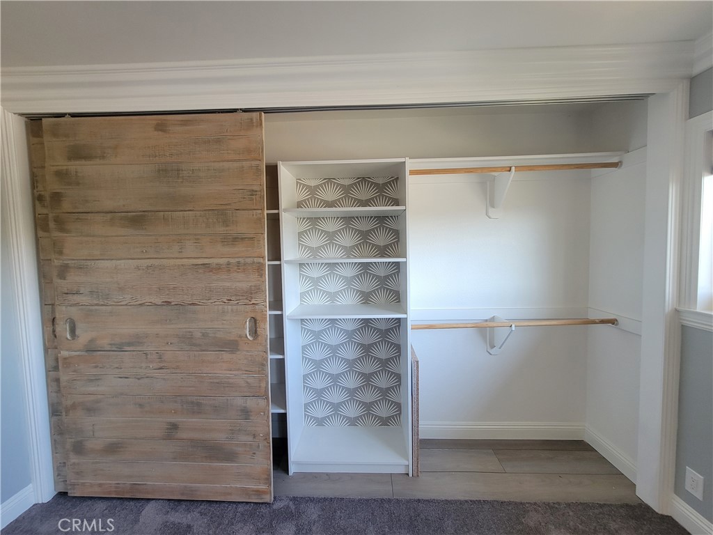 14325 Blackpool Road Westminster, CA 92683 - Photo 22 of 28 a bathroom with a glass shower door