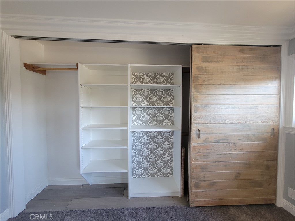 14325 Blackpool Road Westminster, CA 92683 - Photo 23 of 28 a view of walk in closet with empty racks