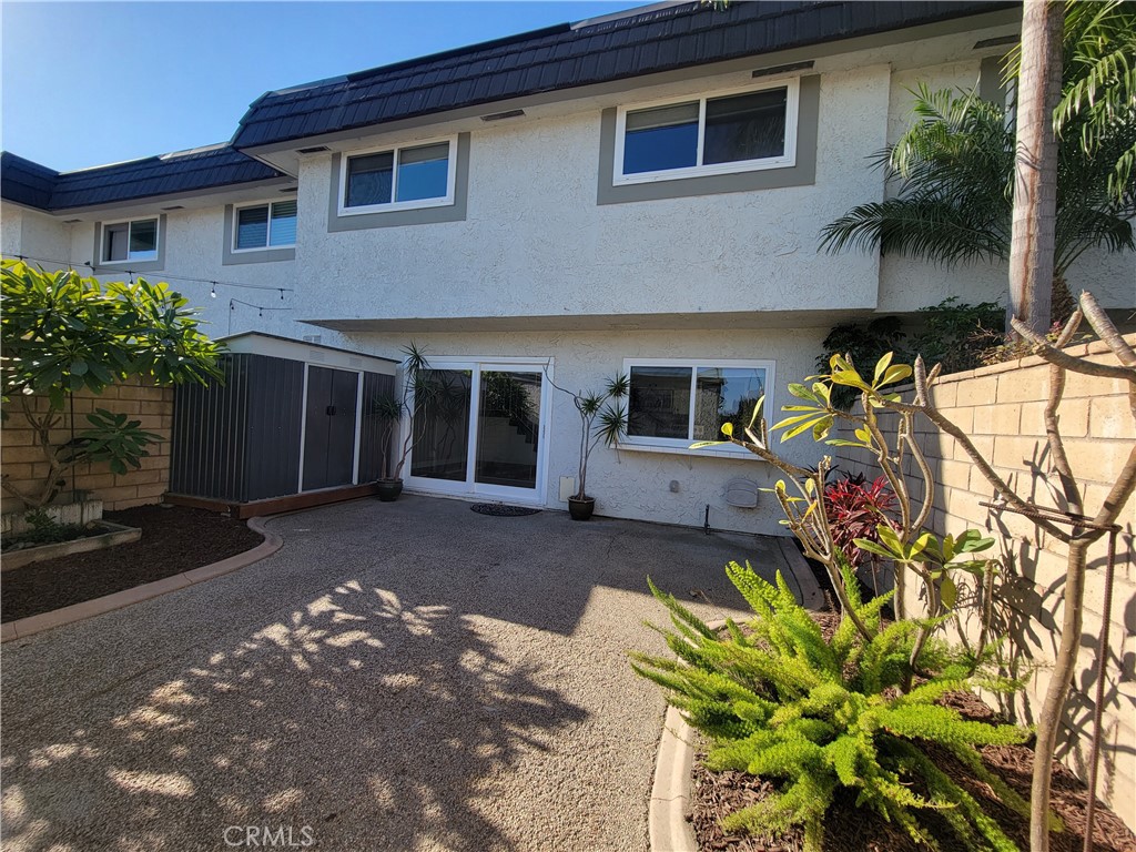 14325 Blackpool Road Westminster, CA 92683 - Photo 26 of 28 a front view of a house with a yard and a garage