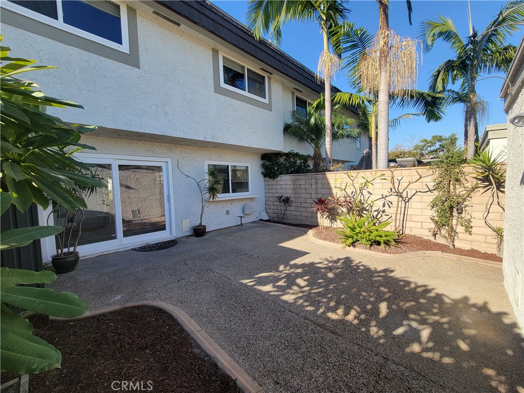 14325 Blackpool Road Westminster, CA 92683 - Photo 27 of 28 a view of a house with a yard and potted plants