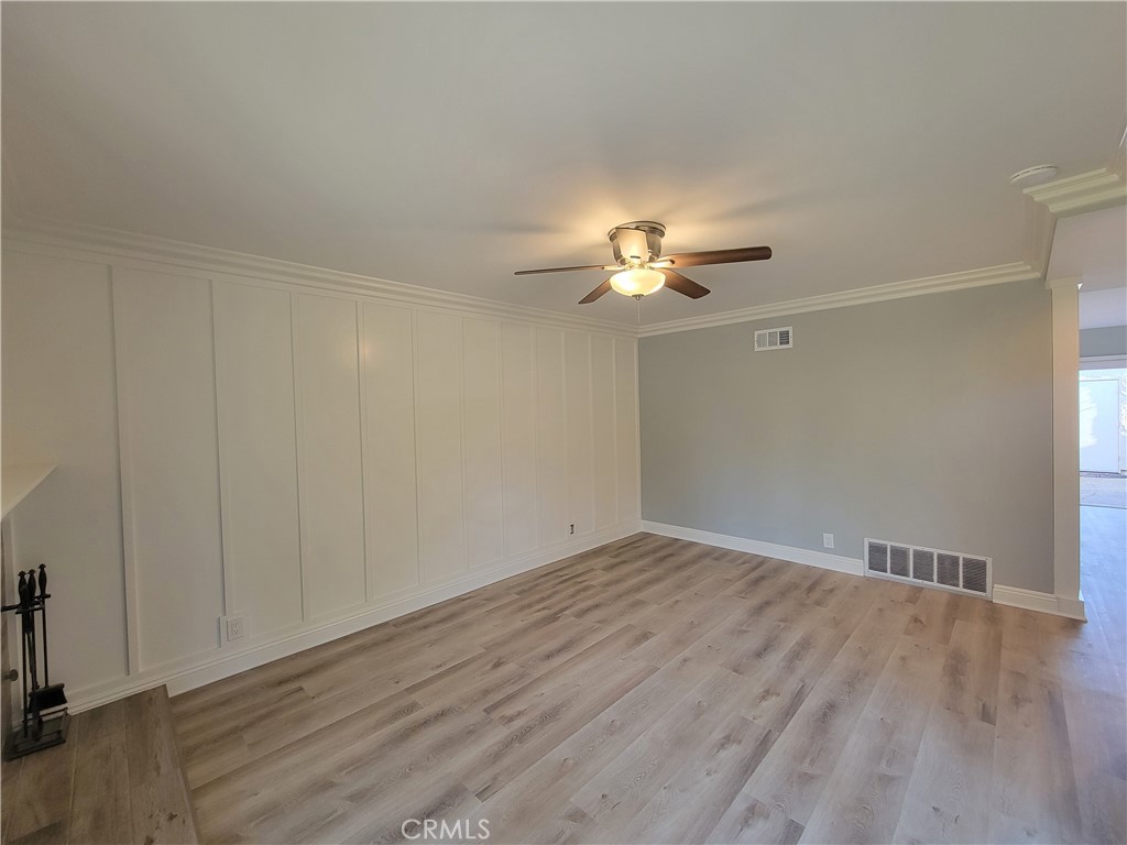 14325 Blackpool Road Westminster, CA 92683 - Photo 6 of 28 a view of an empty room with wooden floor
