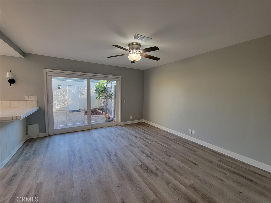 14325 Blackpool Road Westminster, CA 92683 - Photo 8 of 28 wooden floor in an empty room with a window