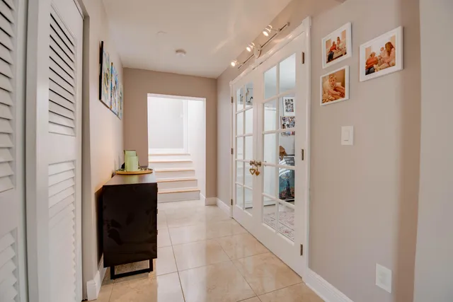 a view of a hallway with front door