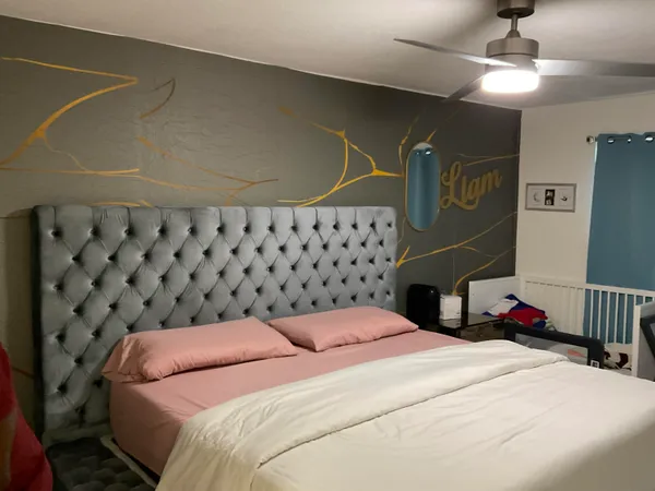 a bedroom with a bed and cabinets