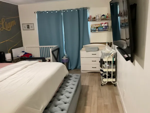 a bed room with a bed and a desk