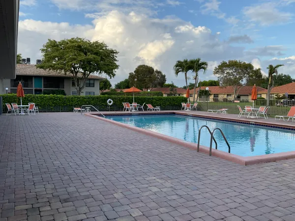 a view of a swimming pool with a patio