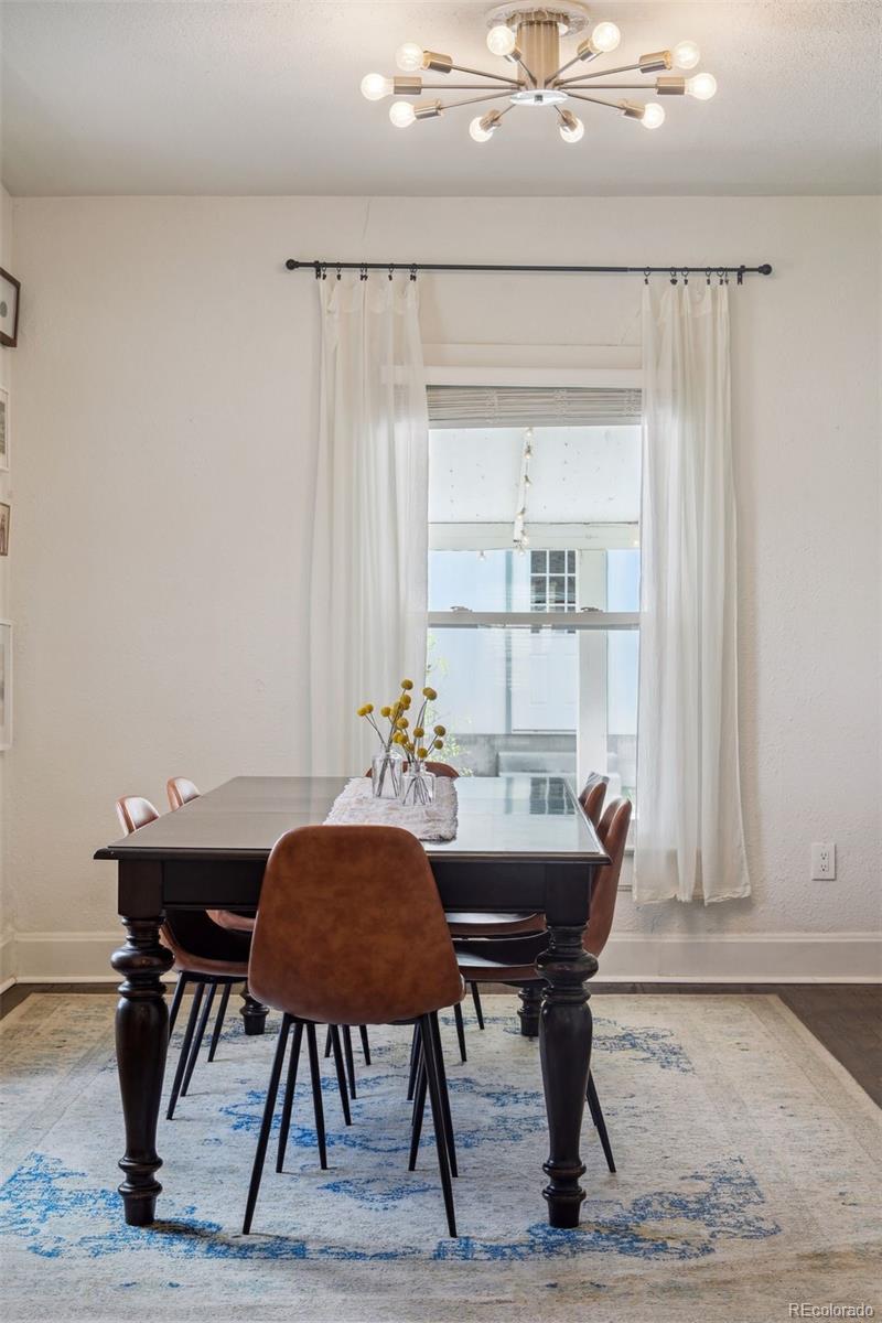 60 Perry Street Denver, CO 80219 - Photo 11 of 43 a view of a dining room with furniture and window